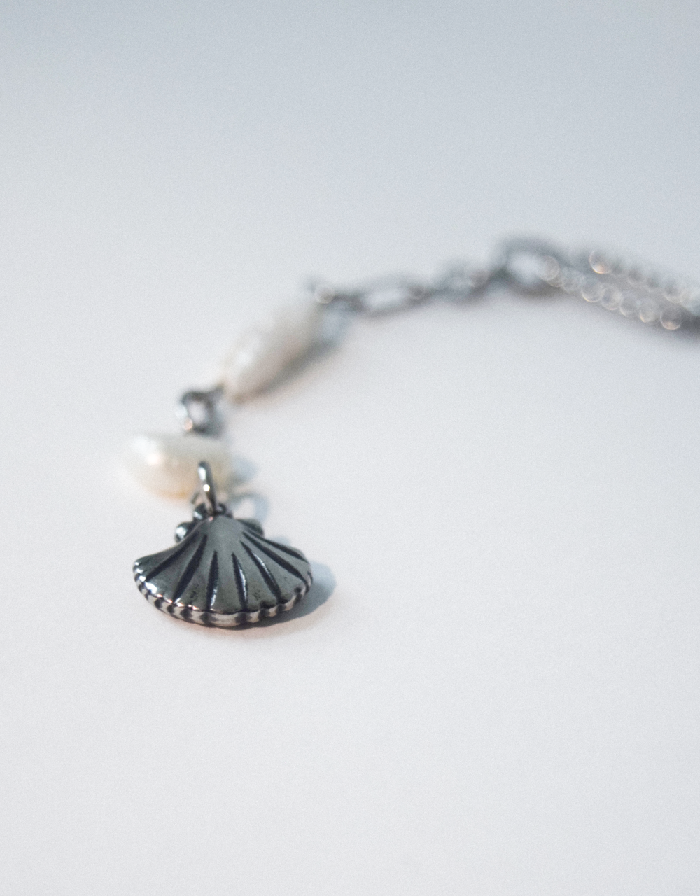 Pearl of seashell charm